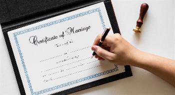 Photo of certificate of marriage being signed