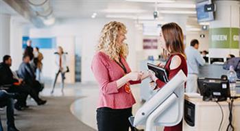 Women talking at Customer and Local Services offices