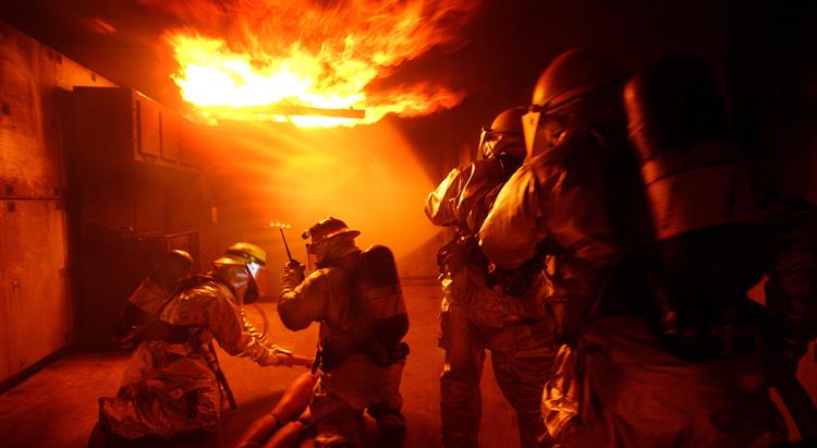 Four firefighters tackle a blaze