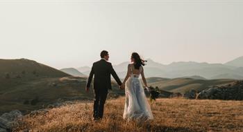 Couple walking on hill