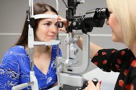 person having slit lamp examination