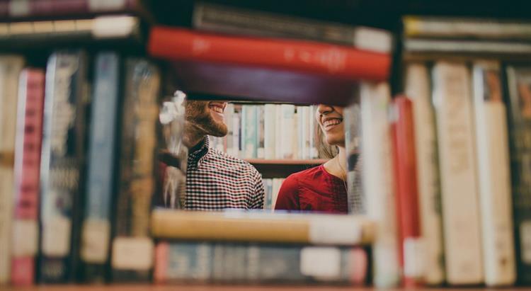 People standing near books