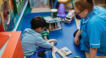 Young child with carer