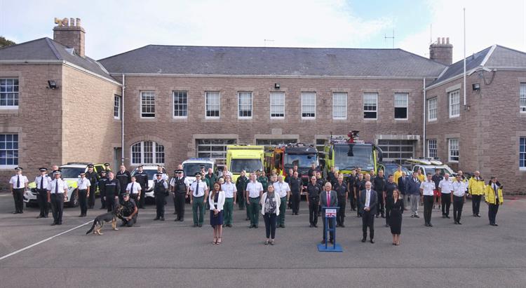 Emergency Services personnel lined up outside Fire and Rescue Headquarters
