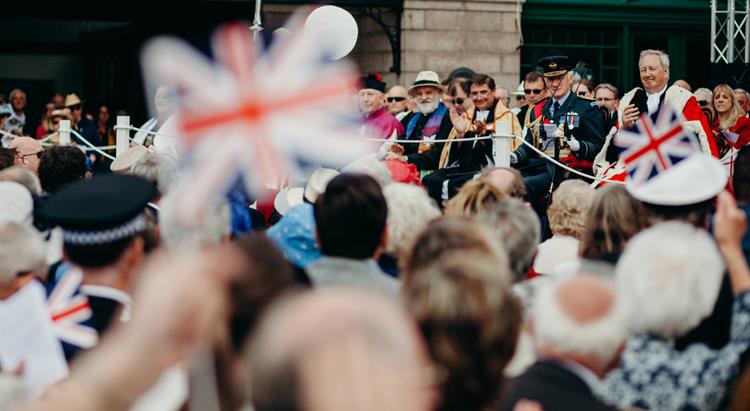 Islanders wave Union Jack flags