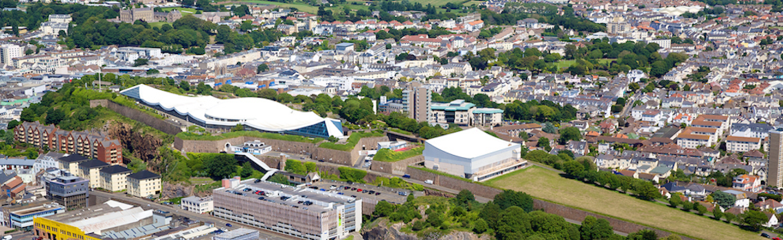 Image taken from St Helier showing Fort Regent and surrounding town