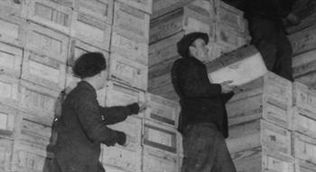 Vintage photo of people unloading parcels