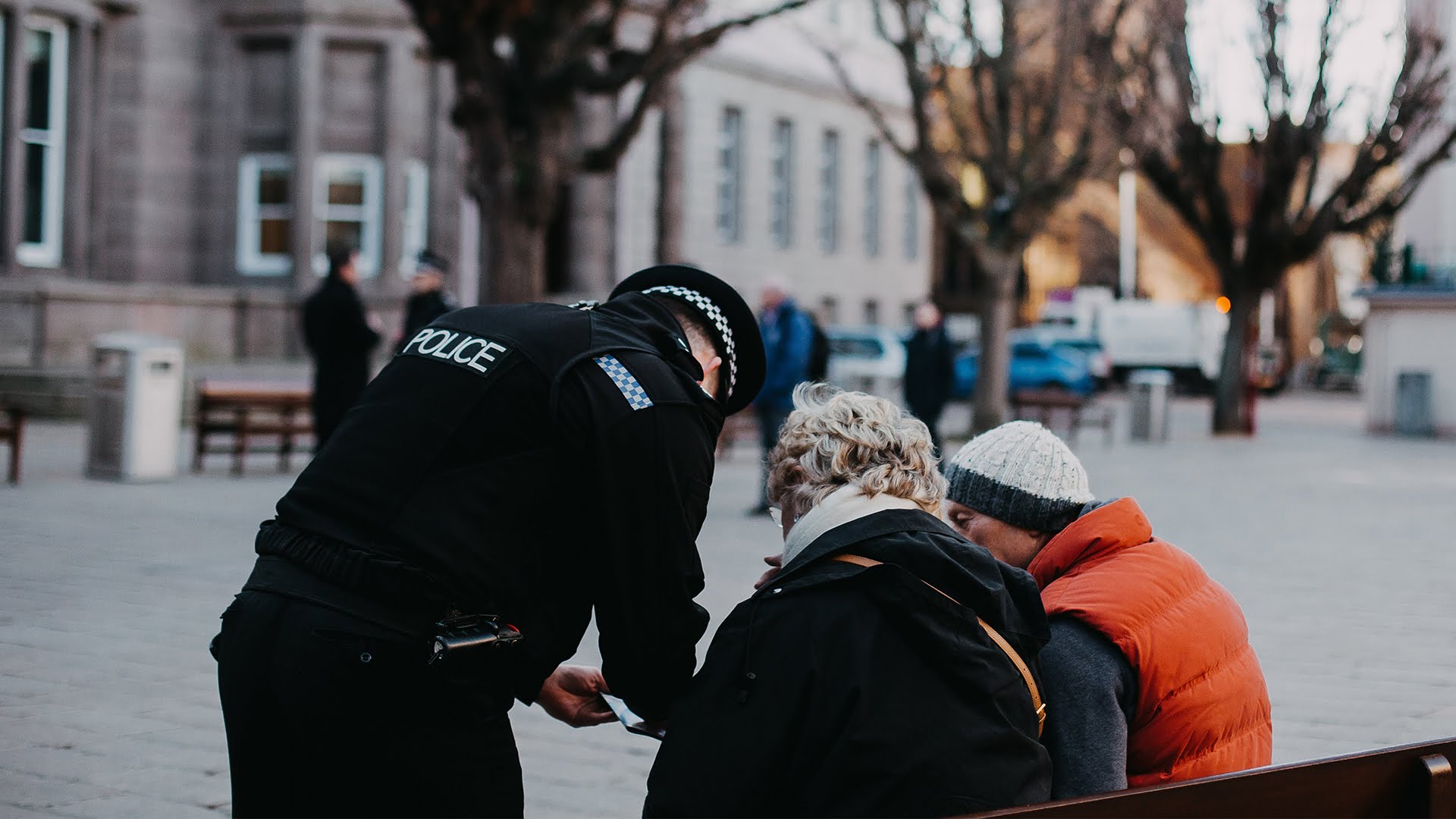 Police helping tourist in square