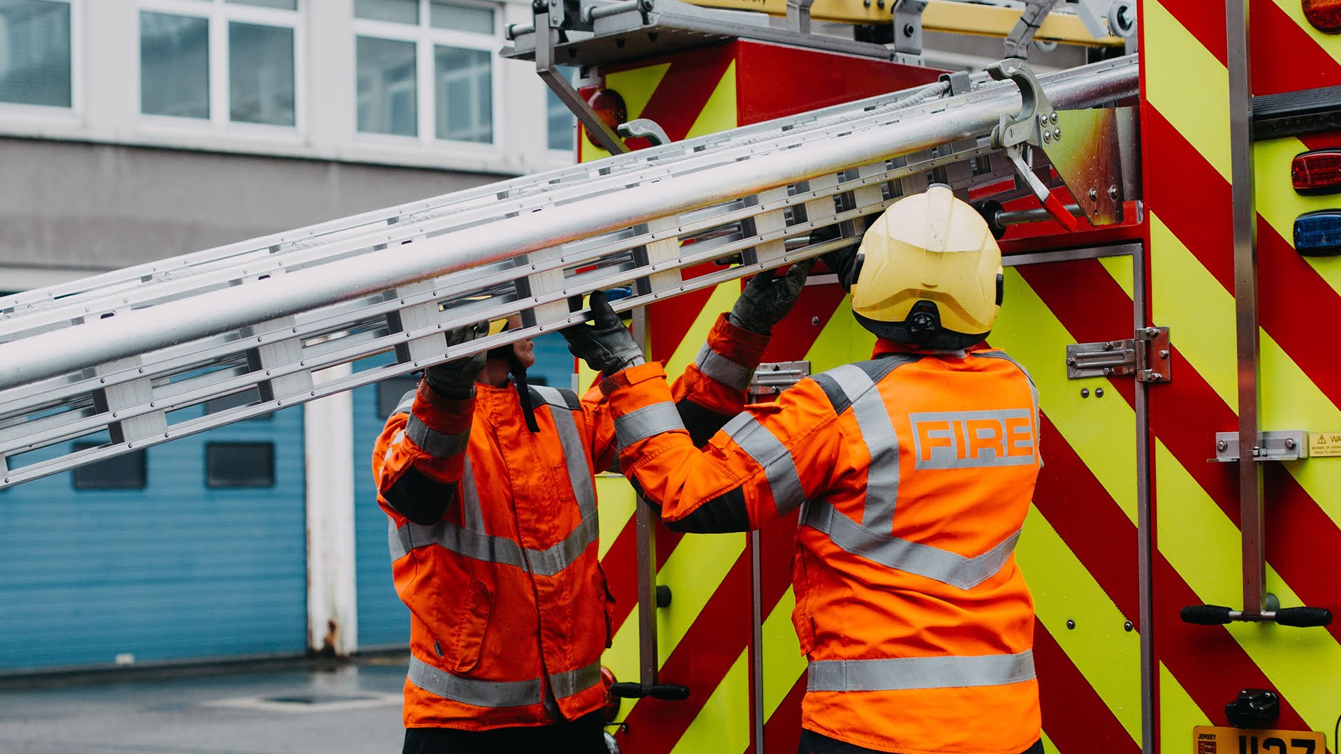 Firemen unloading fire engine