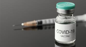 Vial of covid-19 vaccination with needle