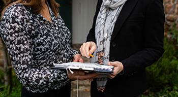 Women holding a document