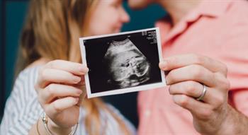 Couple holding scan