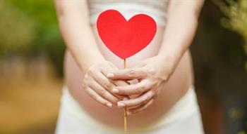 baby bump with heart sign