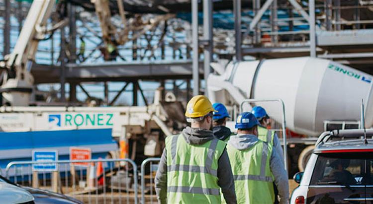 Employees arriving at building site