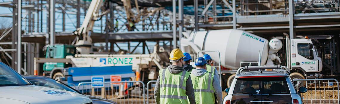 Employees arriving at building site