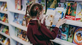 Photo of Primary school pupil looking at book