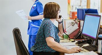 Healthcare receptionist on phone