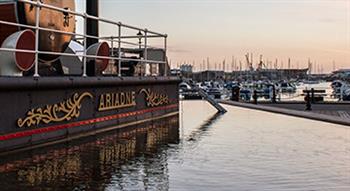 Photo of Jersey steam clock at sunset with view of harbour