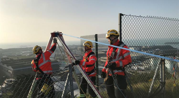 A group of firefighters conduct a rope exercise at Mount Bingham 