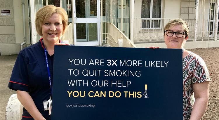 Rhona Reardon and Karen Heyes with a Stoptober sign