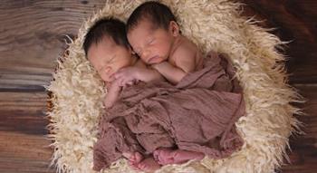 baby twins hugging