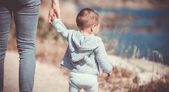 Mother holding baby's hand